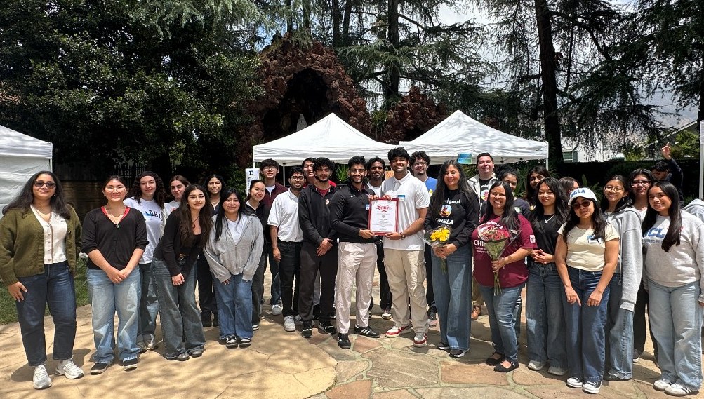 Beyond Borders students and partners gathered outdoors after a community event.